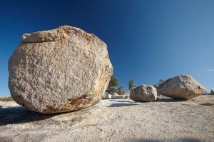 Glacial erratic boulders atop Olmsted Point. Erratics are huge boulders left behind by the passing of glaciers which carved the granite surroundings into their present-day form.  When the glaciers melt, any boulders and other geologic material that it was carrying are left in place, sometimes many miles from their original location.